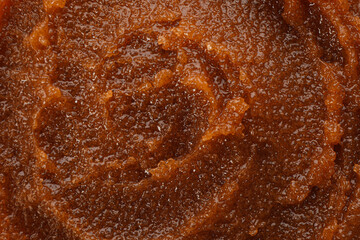 Body scrub as background, closeup. Cosmetic product