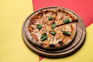 Top view of margherita pizza on bright background