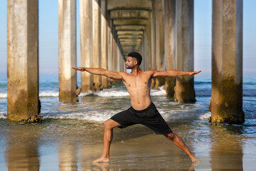 Yoga Male Afro-American Instructor in Warrior II