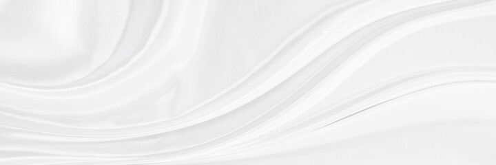 White gray satin texture that is white silver fabric silk panorama background with beautiful soft blur pattern natural.