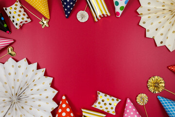 Obraz premium Background for happy birthday celebration or party. Group of colored balloons , confetti, candles, ribbons on red background. Mock up with copy space, place for text
