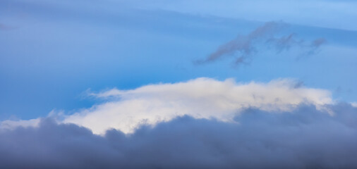 Panoramic View of Puffy Clouds over the Canadian Mountain Landscape. Colorful Winter Sunset Cloudscape Background. Taken in Whistler, British Columbia, Canada.