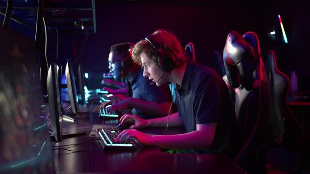 Professional esports players at an online game tournament. The cyber team plays computers and trains