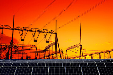 Solar panels and high voltage towers in the evening
