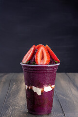 Acai cup with strawberry topping.
