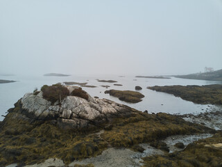 The Hendricks point Lighthouse in very thick fog on the Maine Coast