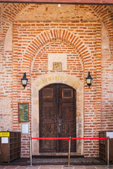 Traditional doorway to an old red brick Suleymaniye Mosque in Alanya castle, Turkey.