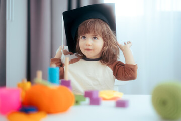 Funny Toddler Girl Wearing Graduation Cap in Kindergarten