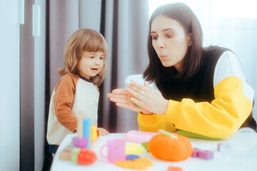 Mother and Daughter Playing with Plasticine Being Creative