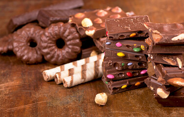 gingerbread cookies and chocolate on a wooden background.