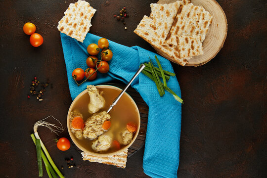 Soup with matzo dumplings and chicken with carrots and tomatoes. Healthy Food for Passover