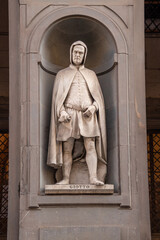 Statue of Giotto di Bondone outside of iconic Uffizi gallery at Florence (Firenze) Italy