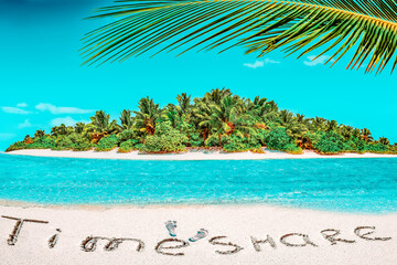 Whole tropical island within atoll in tropical Ocean and inscription "TimeShare" in the sand on a tropical island,  Maldives.