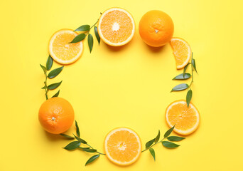 Frame made of fresh oranges on color background