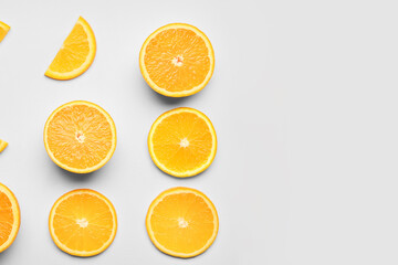 Pieces of fresh orange fruit on white background