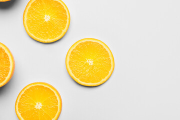 Pieces of fresh orange fruit on white background