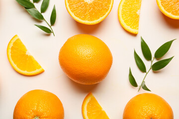 Fresh oranges with green leaves on white background
