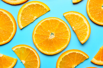 Slices of fresh oranges on color background