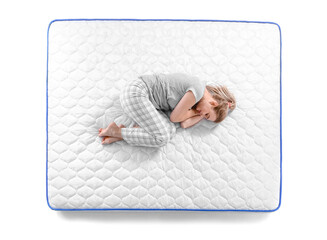 Mature woman sleeping on soft mattress against white background