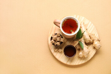 Composition with cup of tasty ginger tea and ingredients on color background