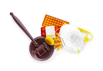 Judge gavel, mask and drugs on white background. Concept of health care reform