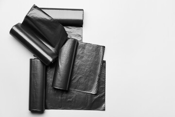 Rolls of garbage bags on white background