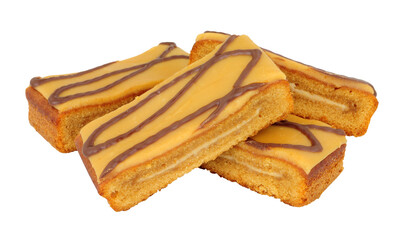 Caramel flavour sponge cake slices topped with salted caramel icing isolated on a white background