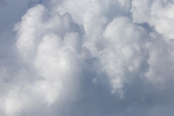 Fototapeta premium Soft white rain clouds on close-up sky beautiful dense look for background design.
