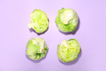 Fototapeta premium Iceberg lettuce on color background