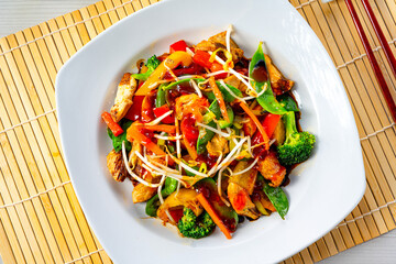 sweet and sour chicken with rice and vegetables