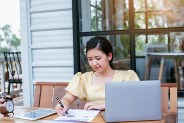 Image of document with charts on background of male and female working , business concept