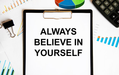 On the tablet for writing the text ALWAYS BELIEVE IN YOURSELF, next to the clip for paper,...