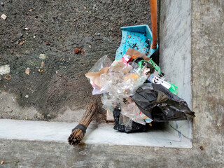 High angle rubbish, dustpans and brooms, dirty environmental background..