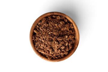 Chocolate granola in wooden bowl isolated on white background.