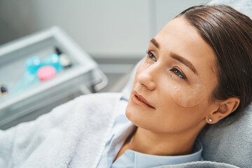 Beauty salon client with hydrogel under-eye patches