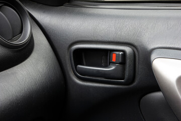 Obraz premium Generic car door open and lock lever close up shot