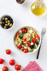 Pasta salad with tuna, tomatoes and white cheese. Farfalle. Healthy eating. Diet.