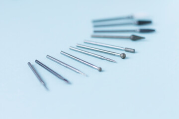 A set of cutters for hardware manicure and pedicure on a light background. Close-up. Space for text