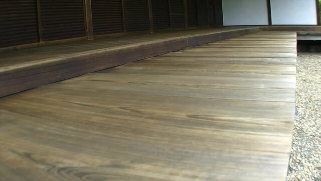 Trucking shot of the hinoki wood porch (engawa) of a Japanese house.
