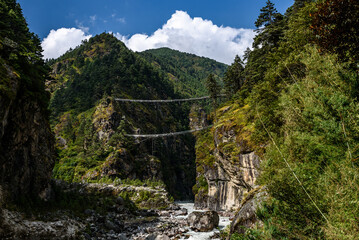 Double traditional suspension bridge in the Himalayas along Mount Everest Base Camp Trail