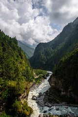 Fototapeta na wymiar Mountain river in the Himalayas along Mount Everest Base Camp Trek