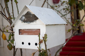 mailbox made of metal material. in the garden, in front of the house.