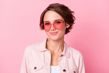 Photo of happy positive young woman wear sunglass good mood isolated on pastel pink color background