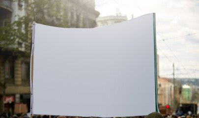 Protesters holding placards and signs on the streets.