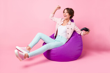 Full size photo of young happy excited crazy smiling girl sir armchair winning in video game...