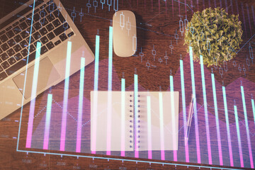 Stock market graph and top view computer on the table background. Double exposure. Concept of financial education.