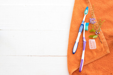 toothbrush health care for oral cavity with flowers arrangement flat lay style on background wooden