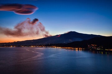 Fire and lava flow during a massive eruption of Mt Etna at twilight - the highest active volcano in...