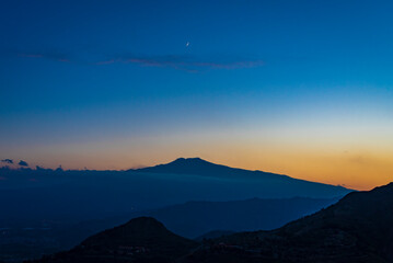 Blue hour landscape view of  Etna volcano in Sicily, Italy. Mountain silhouettes by Twilight 