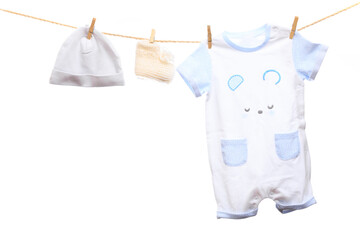 Baby clothes on a clothesline on white  background